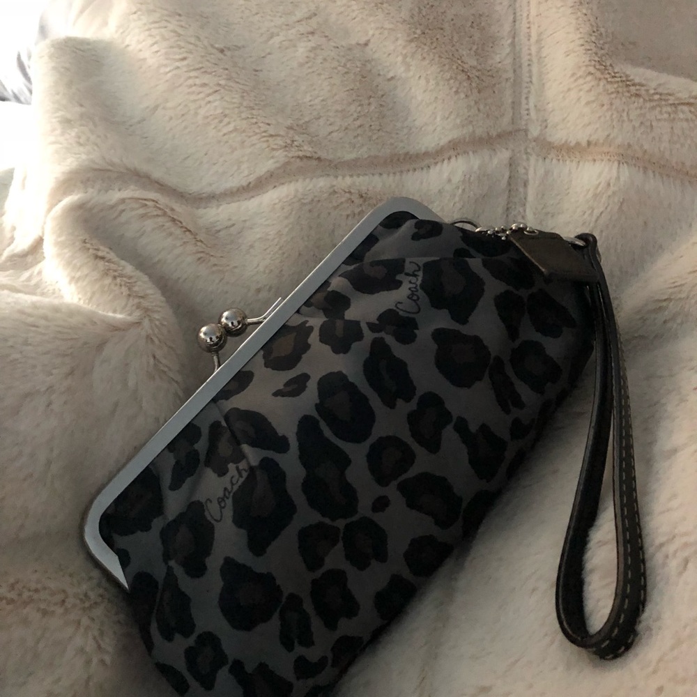 Small hand held clutch or wristlet leopard look